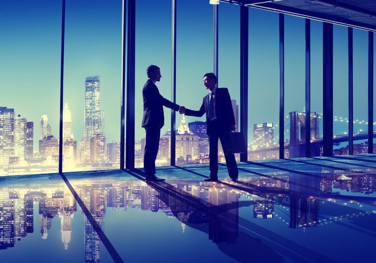 business people hand shake office city concept